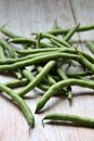 Green beans, green vegetables, beans scattered on a wooden background Royalty Free Stock Photo