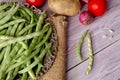 Green beans and vegetables on a wooden background Royalty Free Stock Photo