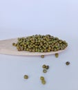 green beans (vigna radiata) on a wooden spoon on a white background Royalty Free Stock Photo