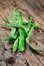 Green beans on wooden cutting board. Go green concept Royalty Free Stock Photo