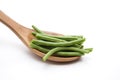 Green beans on wooden spoon