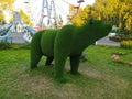 Sculpture of a bear in the Park against the trees Royalty Free Stock Photo