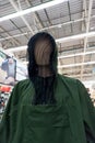 Green beekeeper suit on a mannequin closeup