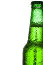 Green beer bottle with water drops over white background Royalty Free Stock Photo