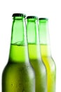 Green beer bottles isolated over white Royalty Free Stock Photo