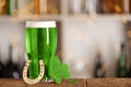 Green beer, horseshoe and clover on counter, space for text. St.Patrick`s Day celebration Royalty Free Stock Photo