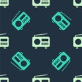 Green and beige Radio with antenna icon isolated seamless pattern on blue background. Vector