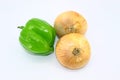 Green bell pepper with onions on white background Royalty Free Stock Photo