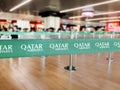 Green belt barrier with the Qatar Airways logo Royalty Free Stock Photo