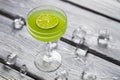 Green beverage with lime slice. Royalty Free Stock Photo