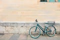 Green bicycle parked, lean on old brick concrete grunge wall and window. vintage color, hipster style, urban lifestyle. Royalty Free Stock Photo