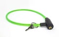 Green bike cable lock with key isolated on white background Royalty Free Stock Photo