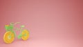 Green bike with sliced orange wheels, healthy lifestyle concept with pink pastel background copy space Royalty Free Stock Photo