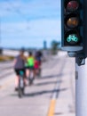 Green Bike traffic lights and riding cyclists