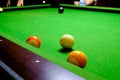 Green billiard table with balls