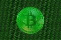 green binary code and a valueable green bitcoin from crypto currency straight Royalty Free Stock Photo