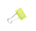 Green binder clip on white background