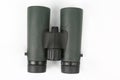 Green binoculars on white background