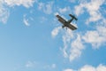 Biplane flying in blue sky and doing stunts during air show Royalty Free Stock Photo