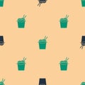 Green and black Asian noodles in paper box and chopsticks icon isolated seamless pattern on beige background. Street Royalty Free Stock Photo