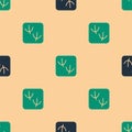 Green and black Dove paw footprint icon isolated seamless pattern on beige background. Vector Royalty Free Stock Photo