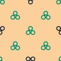 Green and black Fidget spinner icon isolated seamless pattern on beige background. Stress relieving toy. Trendy hand