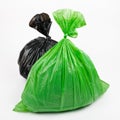 Green and black garbage bags