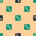 Green and black Human footprints shoes icon isolated seamless pattern on beige background. Shoes sole. Vector Royalty Free Stock Photo