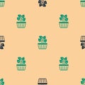 Green and black Indoor plant ivy in a pot icon isolated seamless pattern on beige background. Branch with leaves. Vector Royalty Free Stock Photo