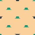 Green and black Man hat with ribbon icon isolated seamless pattern on beige background. Vector Illustration Royalty Free Stock Photo