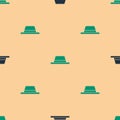 Green and black Man hat with ribbon icon isolated seamless pattern on beige background. Vector Illustration Royalty Free Stock Photo