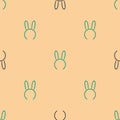 Green and black Mask with long bunny ears icon isolated seamless pattern on beige background. Fetish accessory. Sex toy