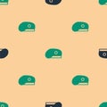 Green and black Military beret icon isolated seamless pattern on beige background. Soldiers cap. Army hat. War baret Royalty Free Stock Photo