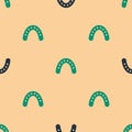 Green and black Mouth guard boxer icon isolated seamless pattern on beige background. Vector