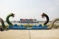 Green and black naga statue for people take photo at Mae khong riverside