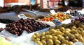 Green and black olives at a farmer market in France, Europe. Italian olive. Street French market at Nice.