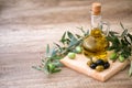 Green and black olives with olives branch and bottle of olive oi Royalty Free Stock Photo