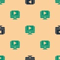 Green and black Online play video icon isolated seamless pattern on beige background. Computer monitor and film strip