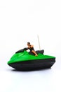 Green and Black Speed Boat Toy  in White Background Royalty Free Stock Photo