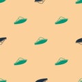 Green and black Speedboat icon isolated seamless pattern on beige background. Vector