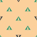 Green and black Tourist tent icon isolated seamless pattern on beige background. Camping symbol. Vector Illustration