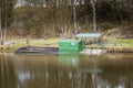 A green and black tranporter boat sunk on the Leeds Liverpool canal near to wigan