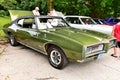 Green with black vinyl top Pontiac GTO from 1968