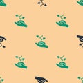 Green and black Volunteer team planting trees icon isolated seamless pattern on beige background. Represents ecological