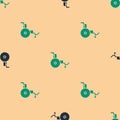 Green and black Wheelchair for disabled person icon isolated seamless pattern on beige background. Vector