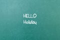 Green blackboard wall texture with a word Hello Holiday Royalty Free Stock Photo