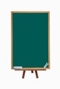 Green blackboard with chalk and eraser on easel with back to school text on isolated background Royalty Free Stock Photo