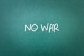 Green blackboard wall texture with a word No War