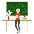 Green blackboard with white lettering welcome back to school red vase with white flowers