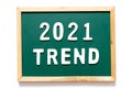 Green blackboard and wood frame with word 2021 trend on white background Royalty Free Stock Photo